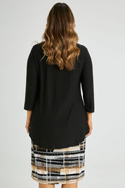 Model Laura wearing size 14 of the Forgiveness Long Dress in colour Camelblk (Black), from the back