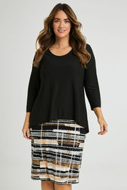 Model Laura wearing size 14 of the Forgiveness Long Dress in colour Camelblk (Black), from the front, cropped image