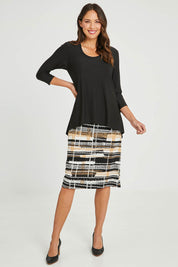 Model Madeline wearing size 10 of the Forgiveness Long Dress in colour Camelblk (Black), from the front, showing the whole outfit
