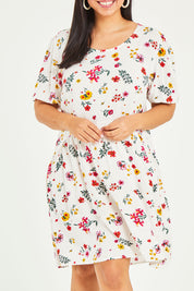 Model Terri-Leigh wearing size 14 of the Paradise Print Tunic Dress in colour Print (White), from the front, cropped image