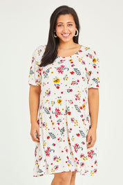 Model Terri-Leigh wearing size 14 of the Paradise Print Tunic Dress in colour Print (White), from the front, cropped image