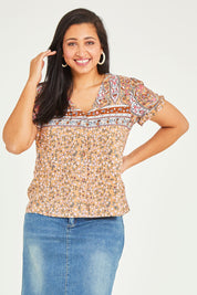 Model Terri-Leigh wearing size 14 of the Summer Top in colour Toffee, from the front, cropped image
