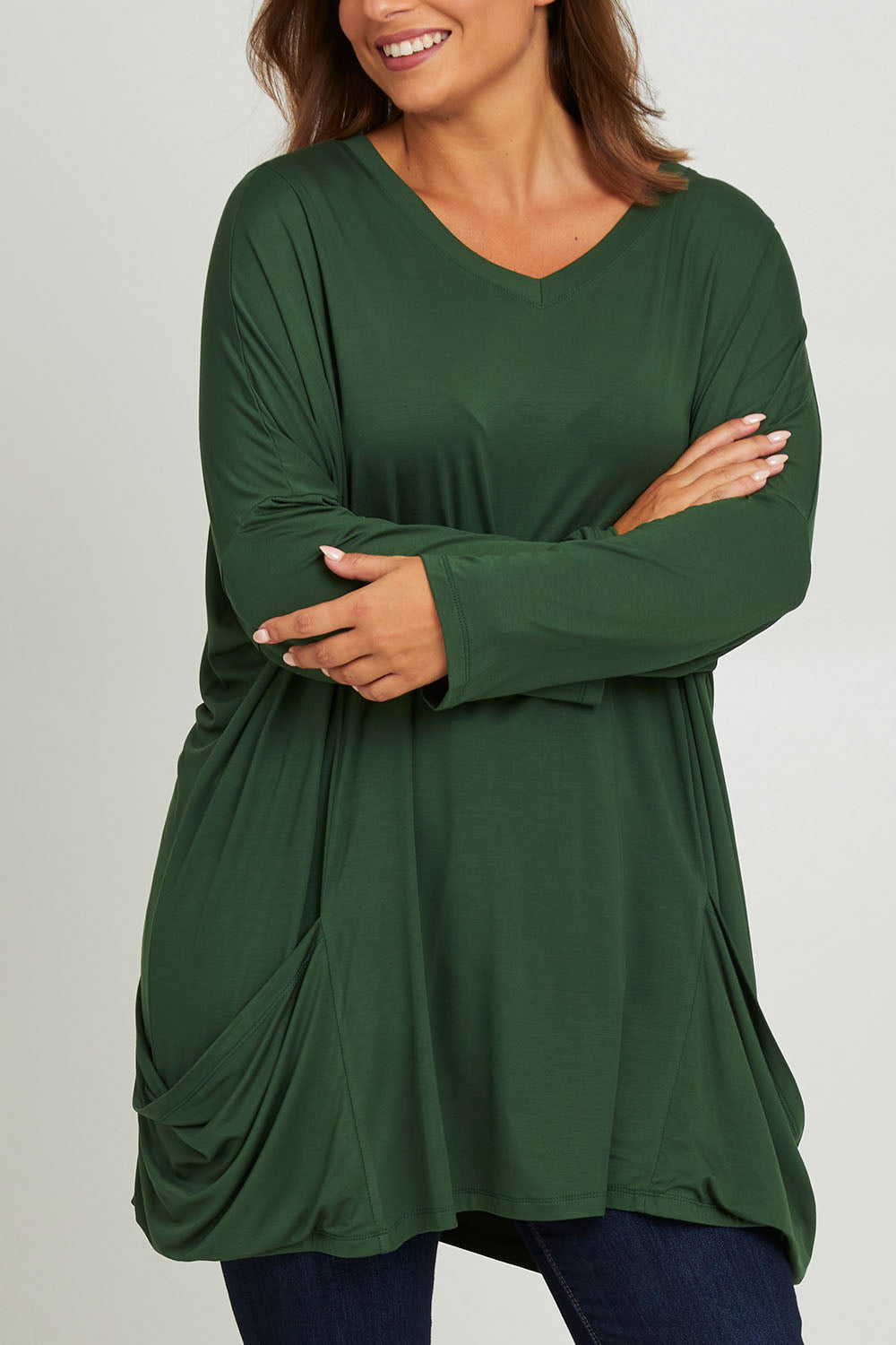 Model Monique wearing size 14 of the Modal Knit L/S Top in colour Green (Green), from the front, cropped image