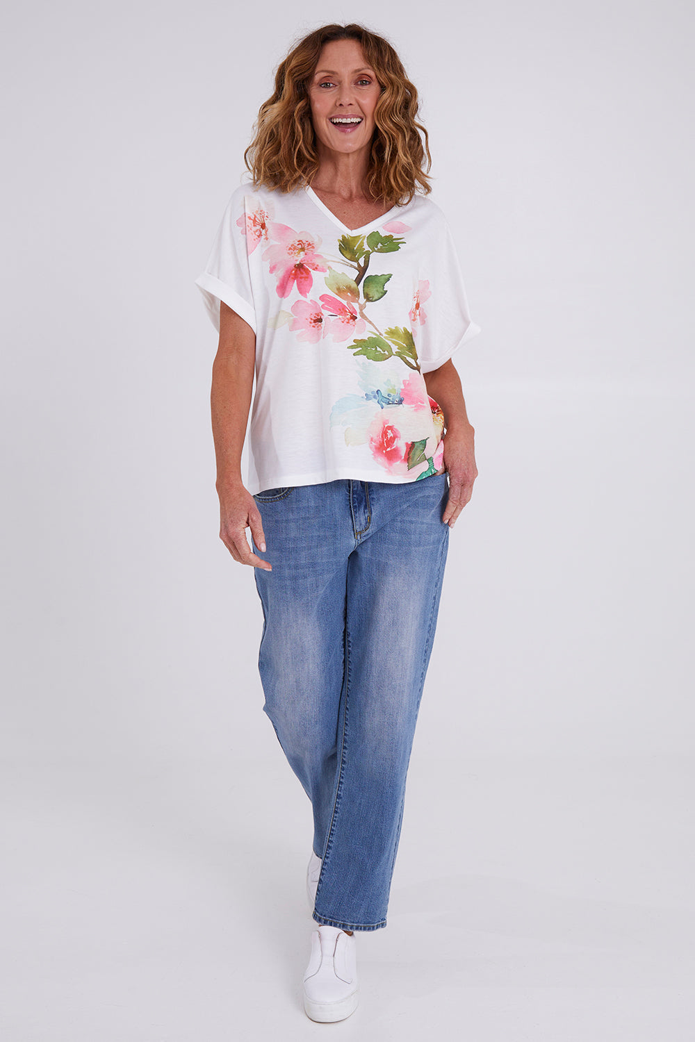Model Emma wearing size 10 of the Floral Bouquet Tee in colour White (White), from the front, showing the whole outfit