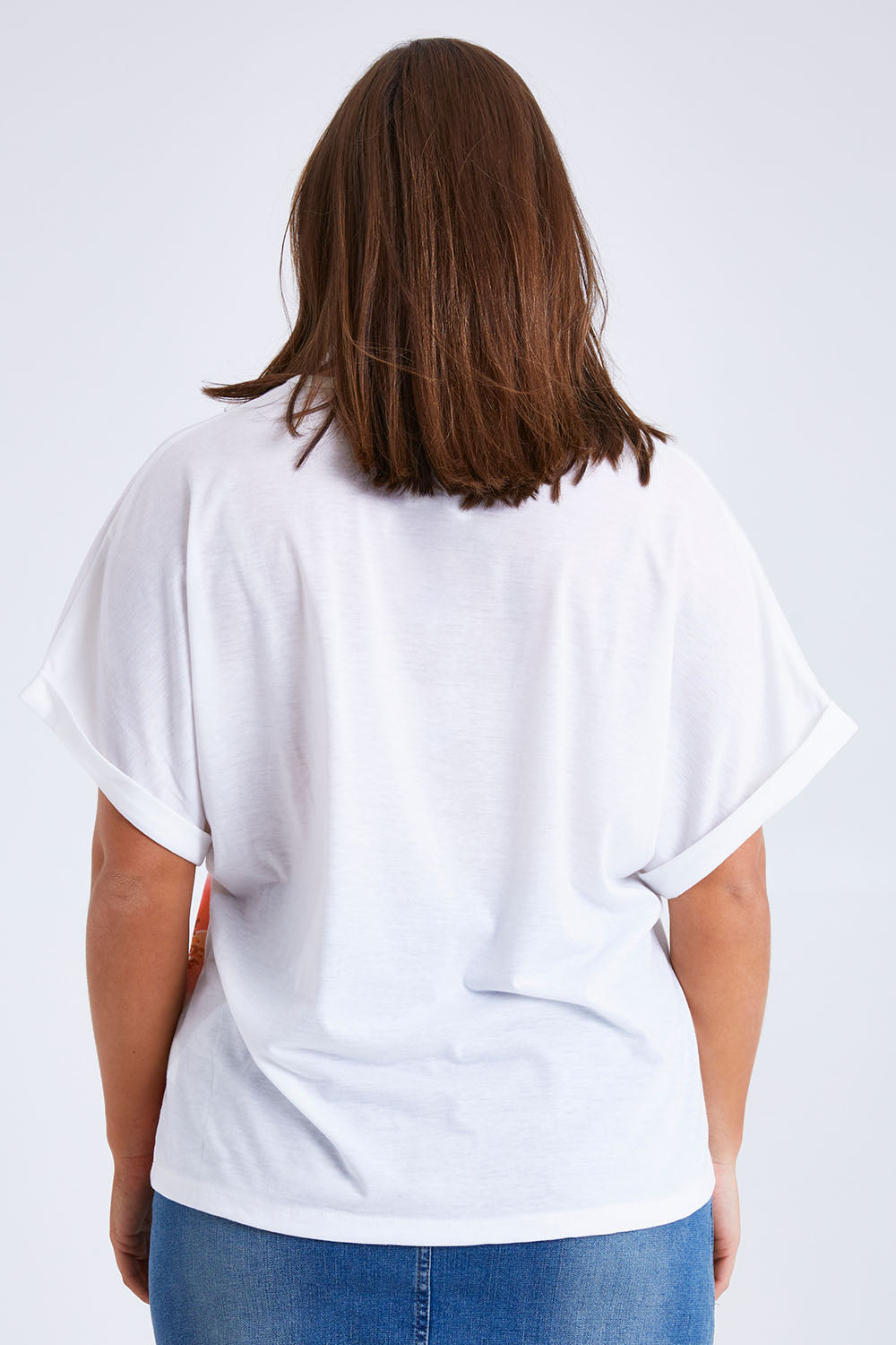 Model Monique wearing size 14 of the Floral Bouquet Tee in colour White (White), from the back