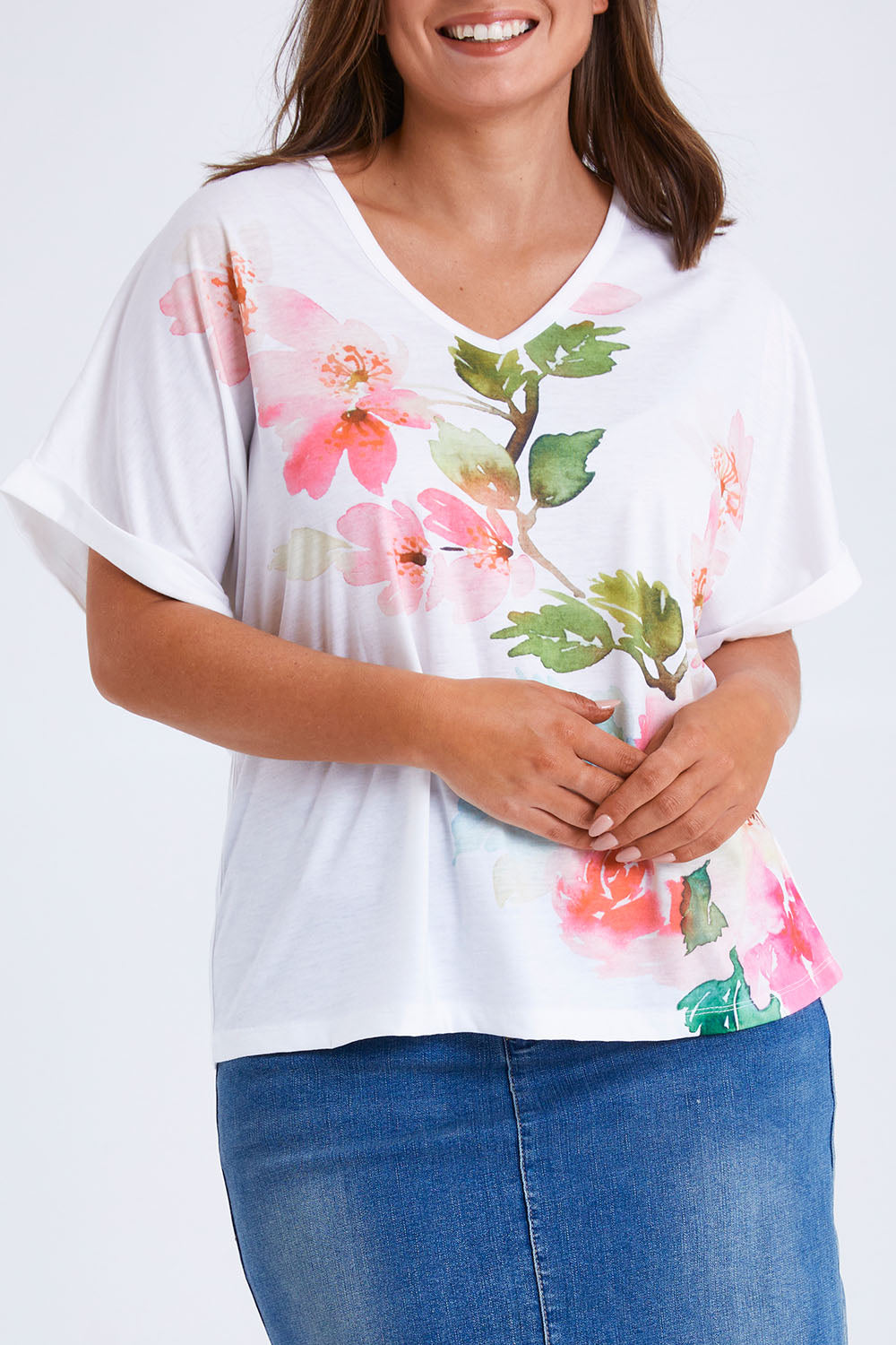 Model Monique wearing size 14 of the Floral Bouquet Tee in colour White (White), from the front, cropped image