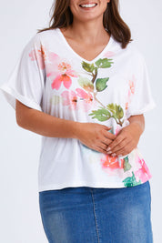 Model Monique wearing size 14 of the Floral Bouquet Tee in colour White (White), from the front, cropped image