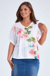 Model Monique wearing size 14 of the Floral Bouquet Tee in colour White (White), from the front, cropped image