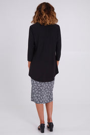 Model Emma wearing size 10 of the Ditsy Delight Forgiveness in colour Blkwhite (Blue), from the back
