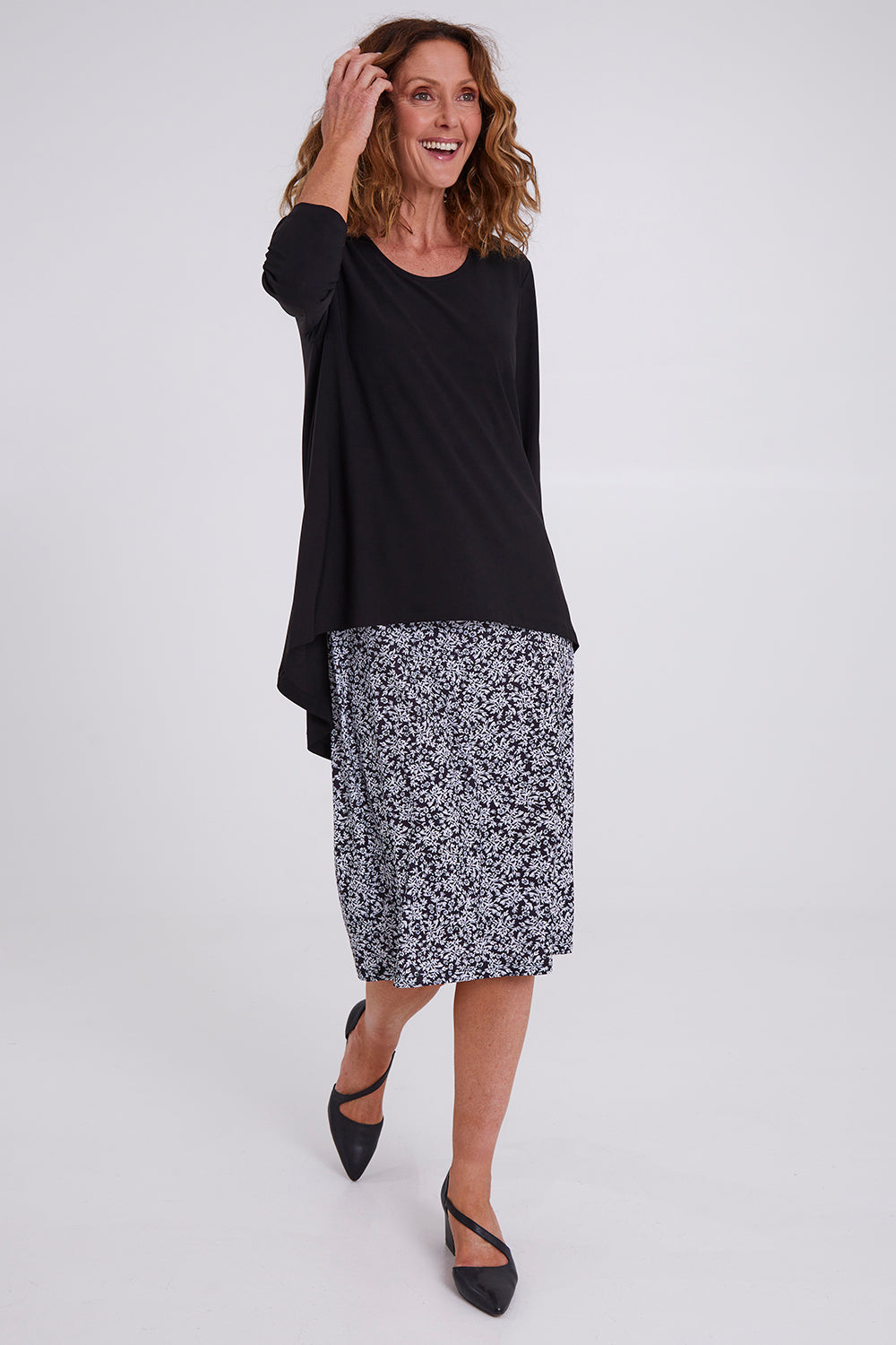 Model Emma wearing size 10 of the Ditsy Delight Forgiveness in colour Blkwhite (Blue), from the front, showing the whole outfit