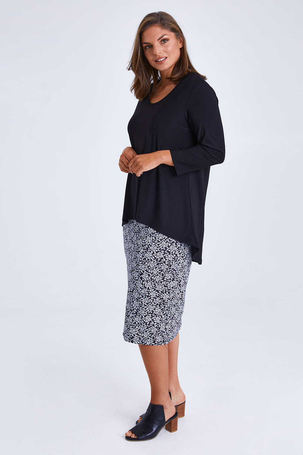 Model Monique wearing size 14 of the Ditsy Delight Forgiveness in colour Blkwhite (Blue), from the front, showing the whole outfit