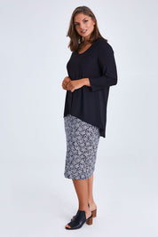 Model Monique wearing size 14 of the Ditsy Delight Forgiveness in colour Blkwhite (Blue), from the front, showing the whole outfit