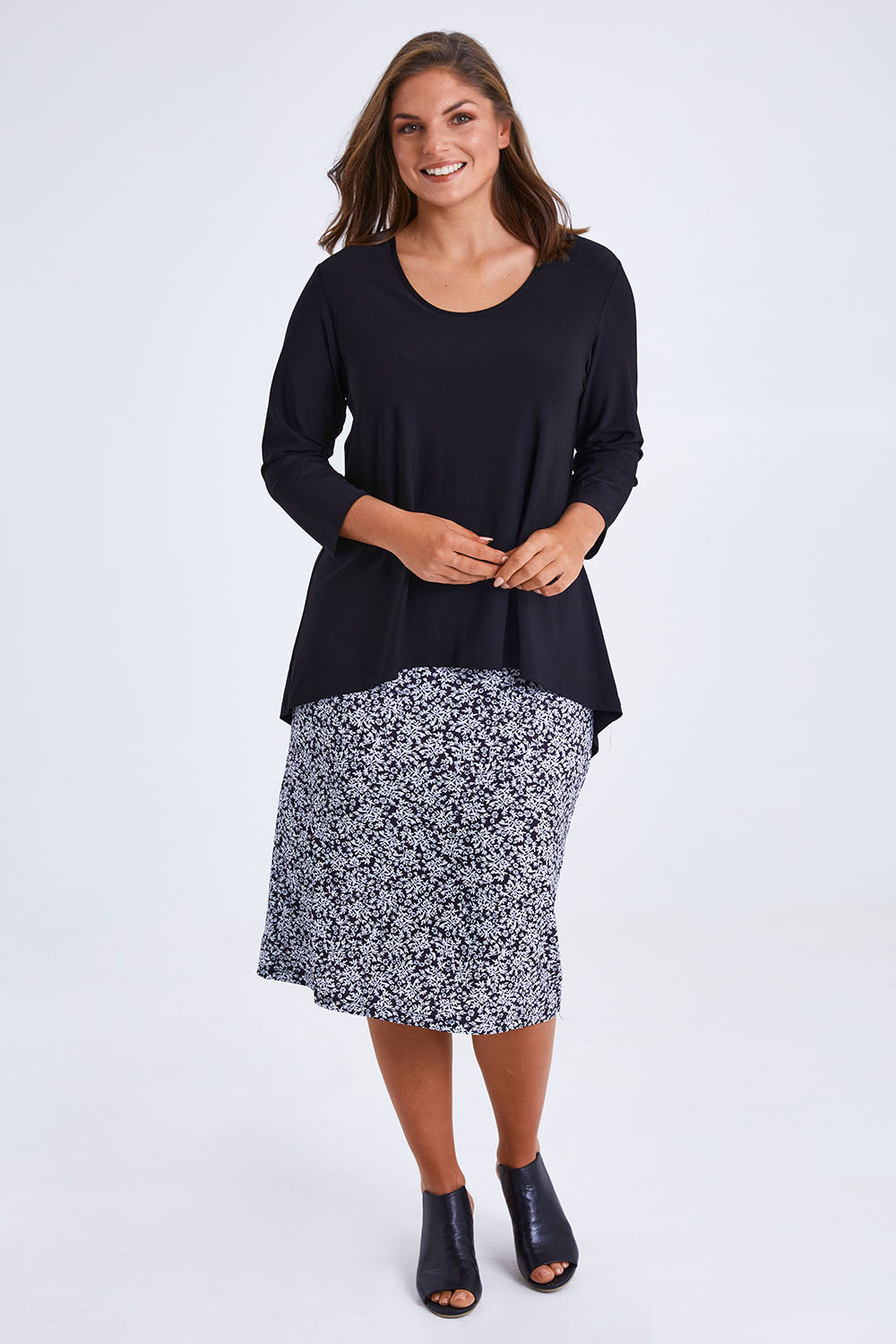Model Monique wearing size 14 of the Ditsy Delight Forgiveness in colour Blkwhite (Blue), from the front, showing the whole outfit