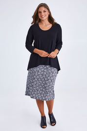 Model Monique wearing size 14 of the Ditsy Delight Forgiveness in colour Blkwhite (Blue), from the front, showing the whole outfit