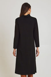 Model Madeline wearing size 10 of the Margie Cowl Pocket Cotton Blend Dress in colour Black (Black), from the back
