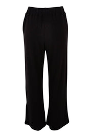 Product shot of the Rachel Rib Pant in colour Black (Black), from the back