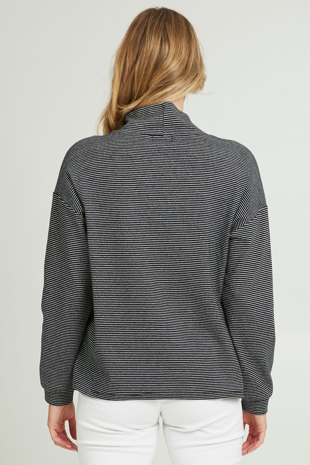 Model Grace wearing size 10 of the Oversized Loose Cowl Top in colour Black (Black), from the back
