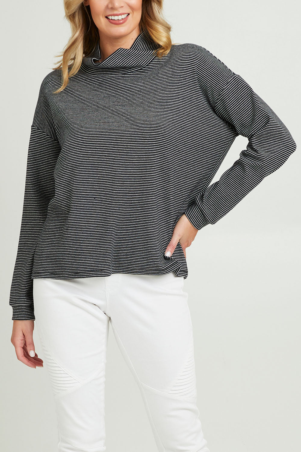 Model Grace wearing size 10 of the Oversized Loose Cowl Top in colour Black (Black), from the front, cropped image