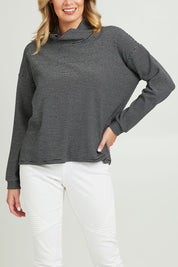 Model Grace wearing size 10 of the Oversized Loose Cowl Top in colour Black (Black), from the front, cropped image