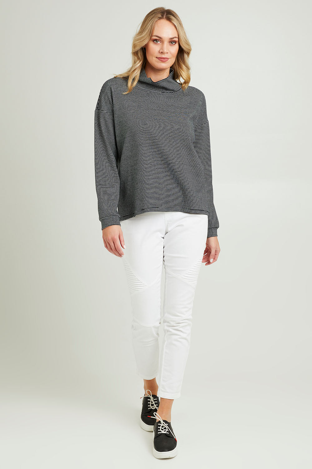 Model Grace wearing size 10 of the Oversized Loose Cowl Top in colour Black (Black), from the front, showing the whole outfit