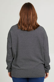 Model Monique wearing size 14 of the Oversized Loose Cowl Top in colour Black (Black), from the back