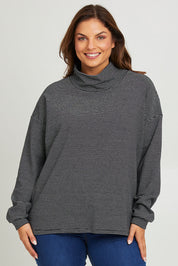 Model Monique wearing size 14 of the Oversized Loose Cowl Top in colour Black (Black), from the front, cropped image