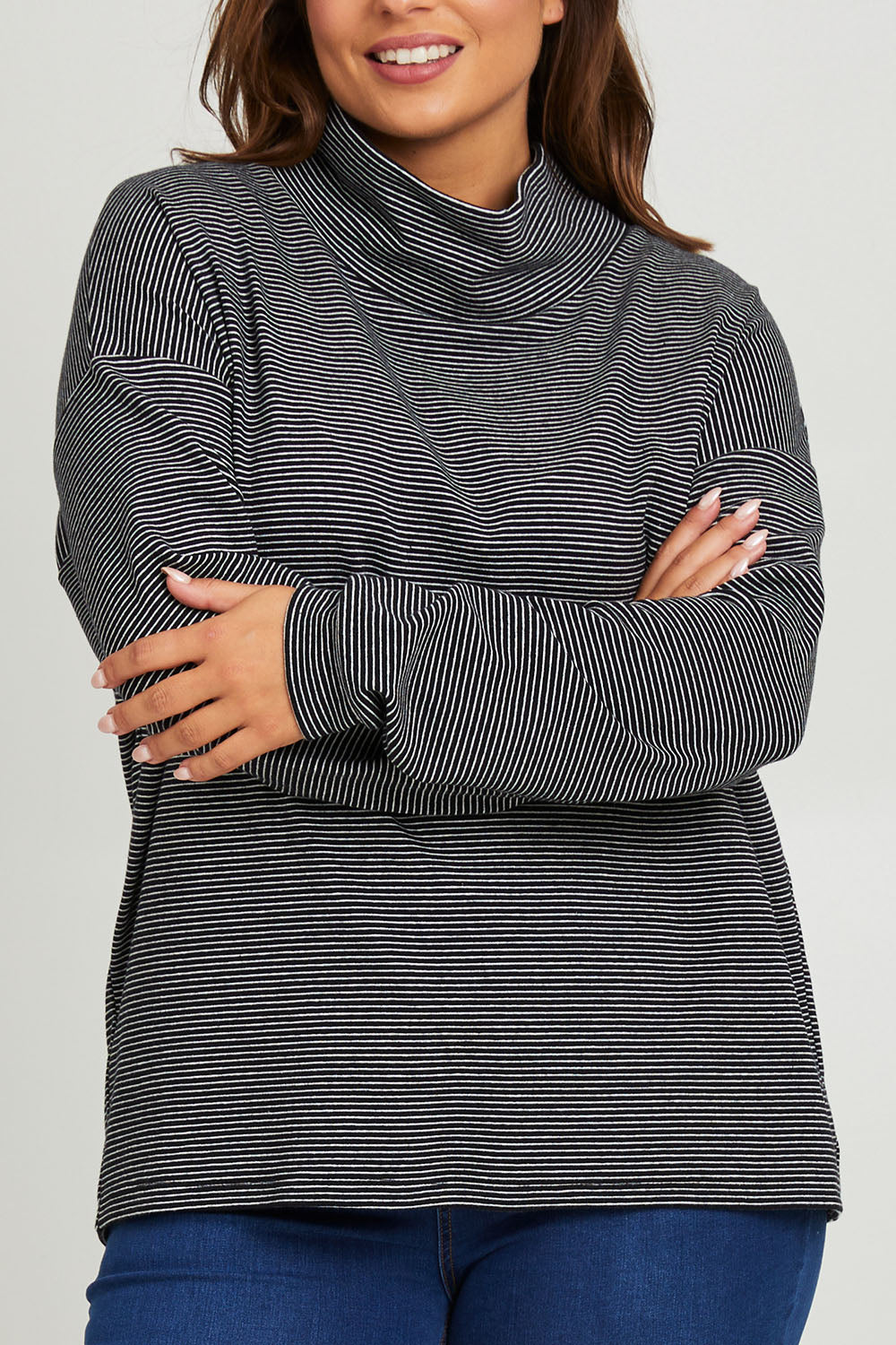 Model Monique wearing size 14 of the Oversized Loose Cowl Top in colour Black (Black), from the front, cropped image