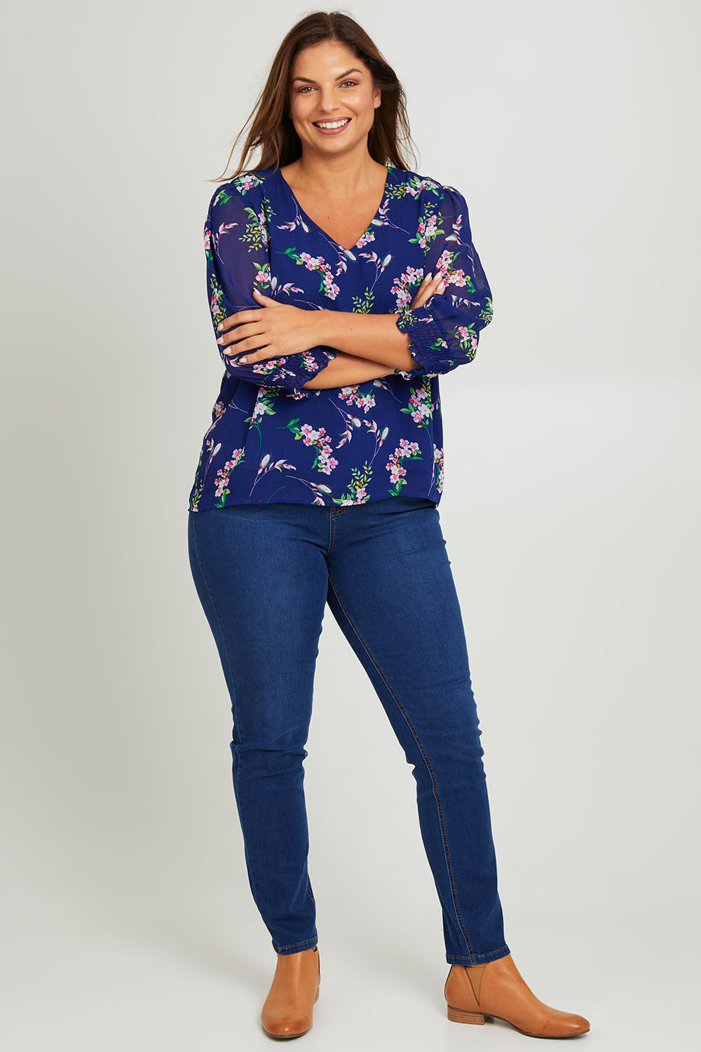 Model Monique wearing size 14 of the Felicity Chiffon Top in colour Blue (Blue), from the front, showing the whole outfit