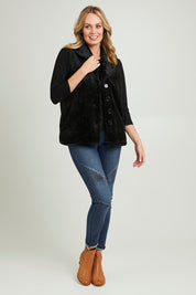 Model Grace wearing size 10 of the Unreal Core Vest in colour Black (Black), from the front, showing the whole outfit