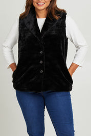 Model Monique wearing size 14 of the Unreal Core Vest in colour Black (Black), from the front, cropped image