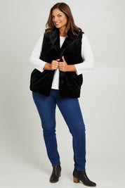 Model Monique wearing size 14 of the Unreal Core Vest in colour Black (Black), from the front, showing the whole outfit