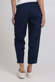 Model Madeline wearing size 10 of the Cotton Linen Comfort Pant in colour Navy (Blue), from the back
