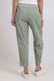 Model Madeline wearing size 10 of the Cotton Linen Comfort Pant in colour Sage (Green), from the back