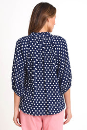 Model Madelinec wearing size 10 of the Relaxed Print Top – Navywhite in colour Navywhite, from the back