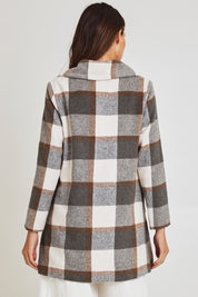Model Madeline wearing size 10 of the Check Coat in colour Silver (Grey), from the back