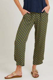 Model Grace wearing size 10 of the Java Crop Pant in colour Teal (Green), from the front, cropped image