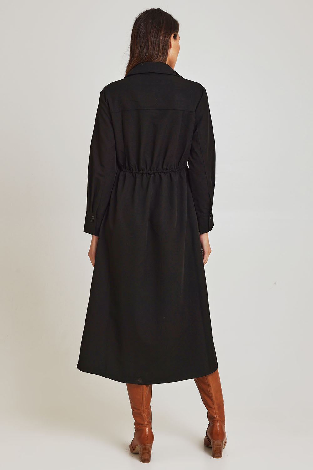 Model Madeline wearing size 10 of the Soft Fluid Dress in colour Black (Black), from the back