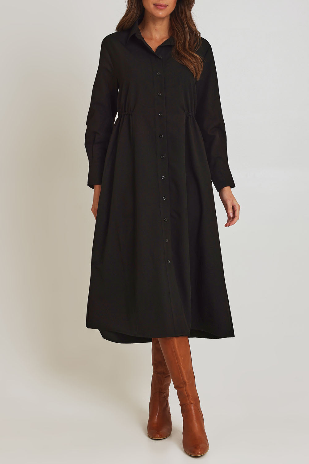 Model Madeline wearing size 10 of the Soft Fluid Dress in colour Black (Black), from the front, cropped image