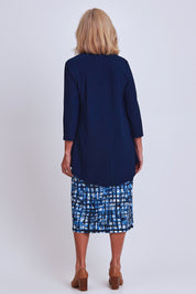 Model Sandy wearing size 10 of the Forgiveness Dress in colour Navyprint (Blue), from the back