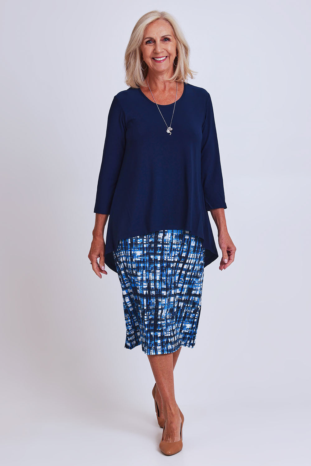 Model Sandy wearing size 10 of the Forgiveness Dress in colour Navyprint (Blue), from the front, showing the whole outfit