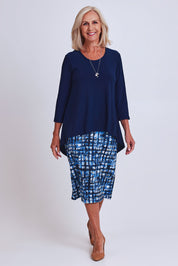 Model Sandy wearing size 10 of the Forgiveness Dress in colour Navyprint (Blue), from the front, showing the whole outfit