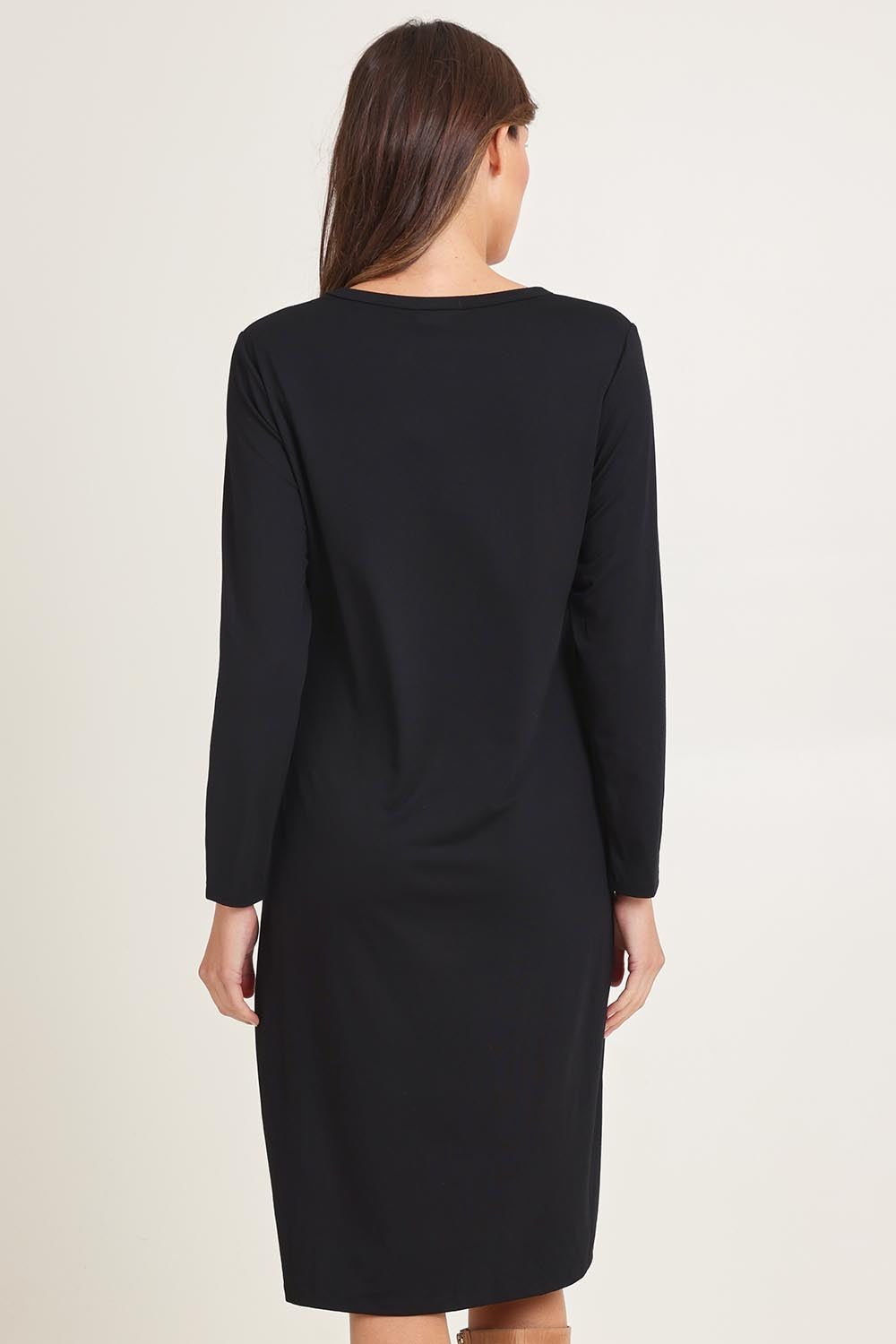 Model Madeline wearing size 10 of the Bamboo Dress in colour Black (Black), from the back