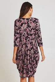 Model Madeline wearing size 10 of the Bounce Dress in colour Purple (Purple), from the back