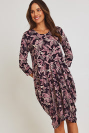 Model Madeline wearing size 10 of the Bounce Dress in colour Purple (Purple), from the front, cropped image
