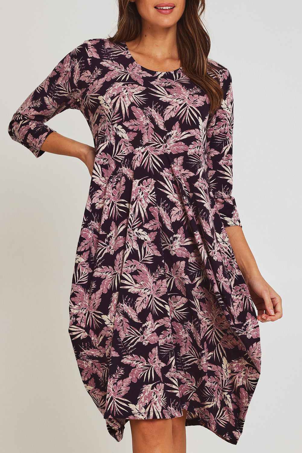 Model Madeline wearing size 10 of the Bounce Dress in colour Purple (Purple), from the front, cropped image