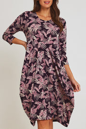 Model Madeline wearing size 10 of the Bounce Dress in colour Purple (Purple), from the front, cropped image