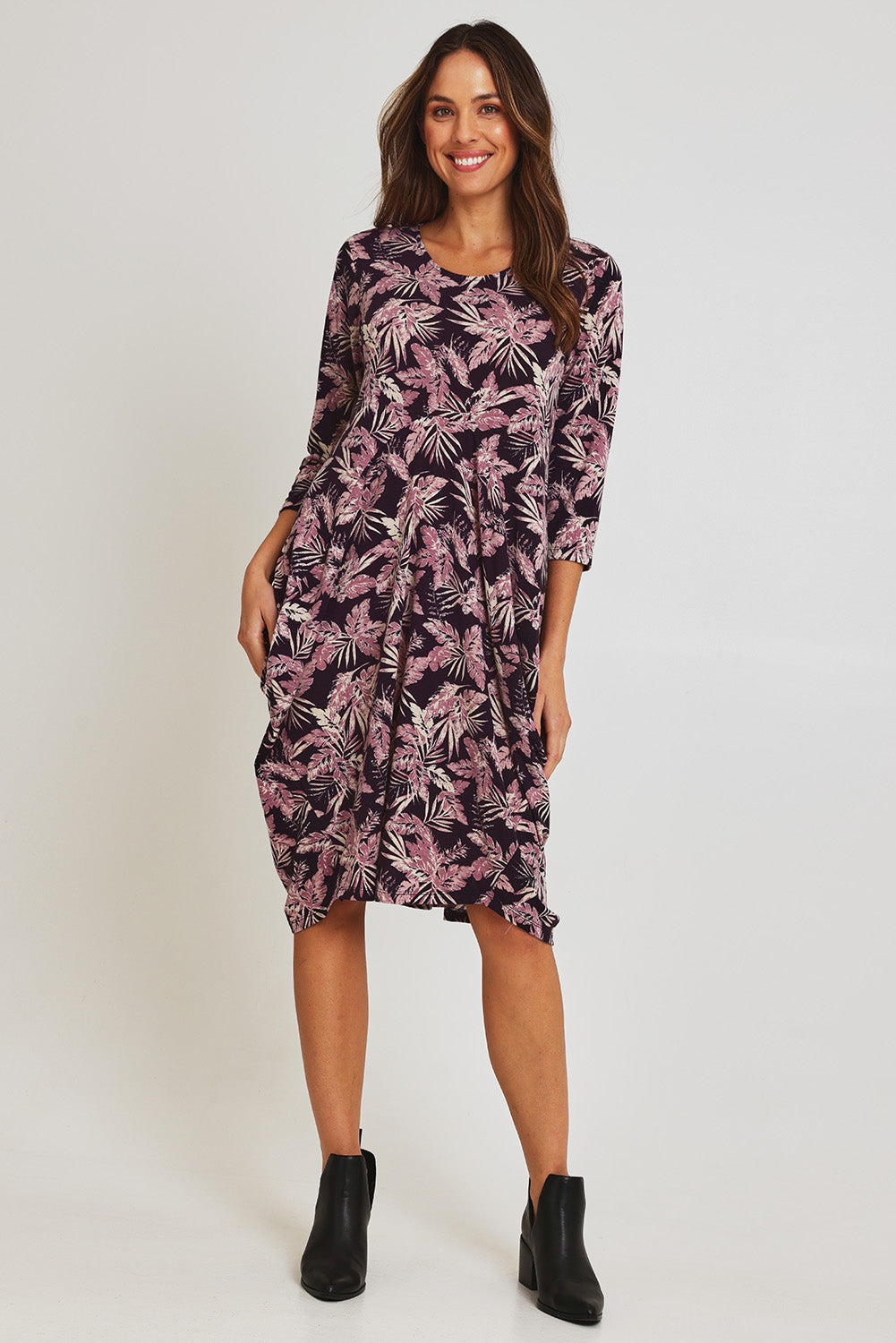 Model Madeline wearing size 10 of the Bounce Dress in colour Purple (Purple), from the front, showing the whole outfit