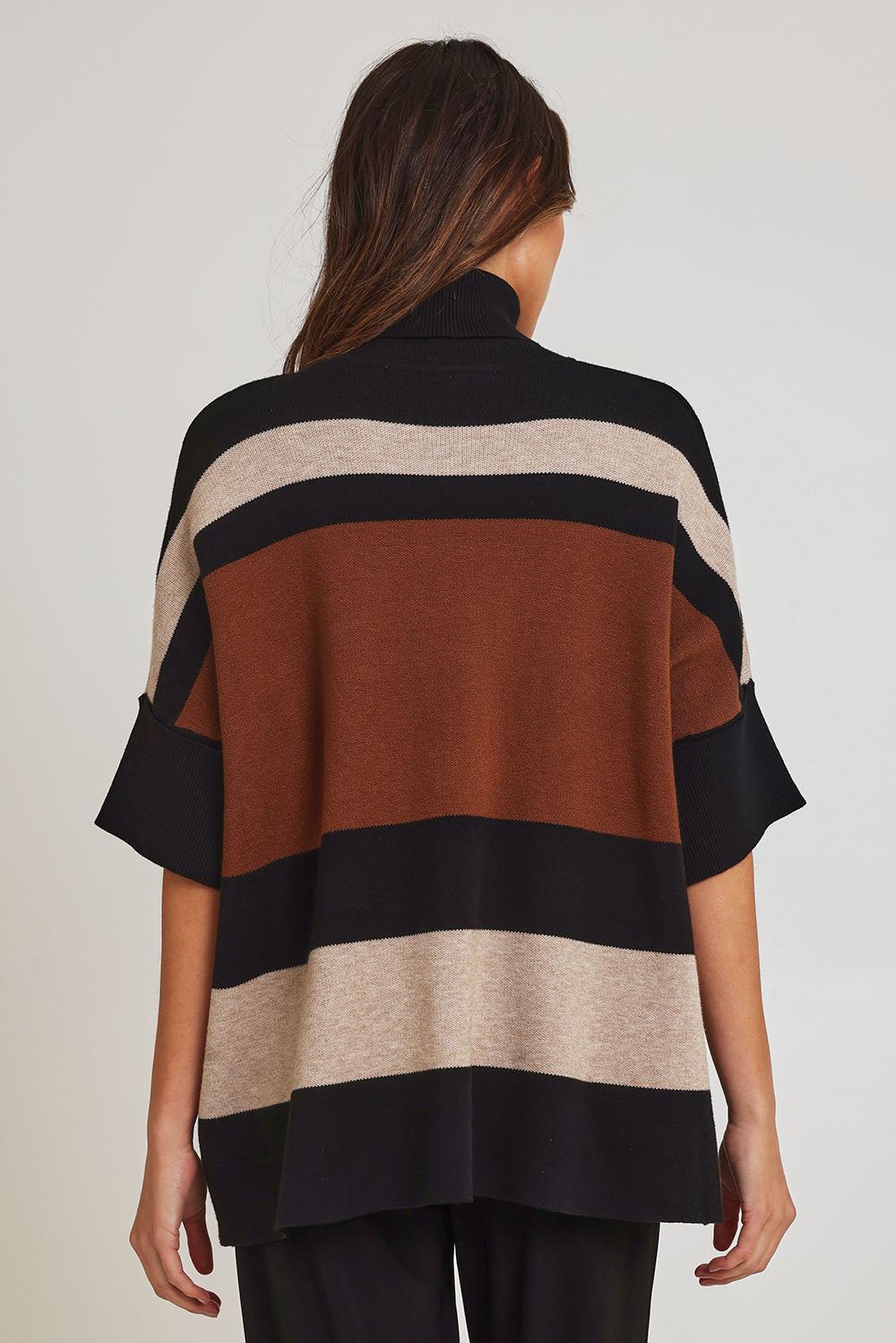 Model Madeline wearing size OneSize of the Stripe Polo Knit Pullover in colour Coffee, from the back