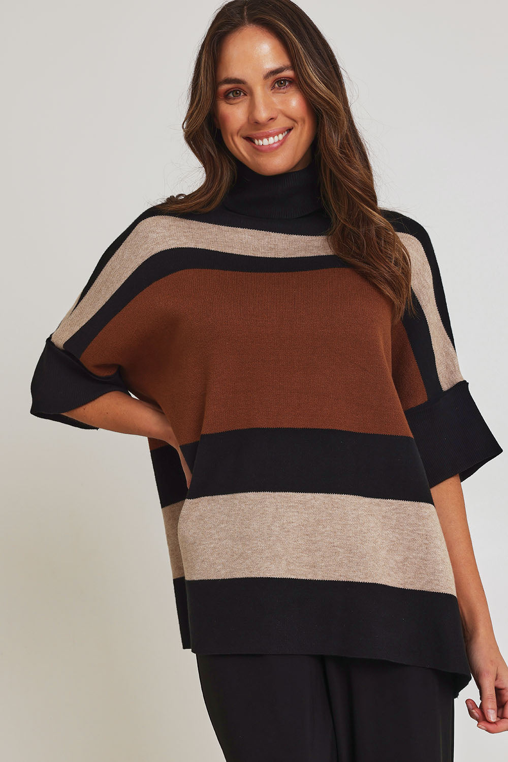 Model Madeline wearing size OneSize of the Stripe Polo Knit Pullover in colour Coffee, from the front, cropped image