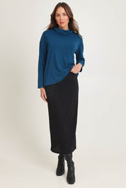 Model Madeline wearing size 10 of the Knit Core Skirt in colour Black (Black), from the front, showing the whole outfit